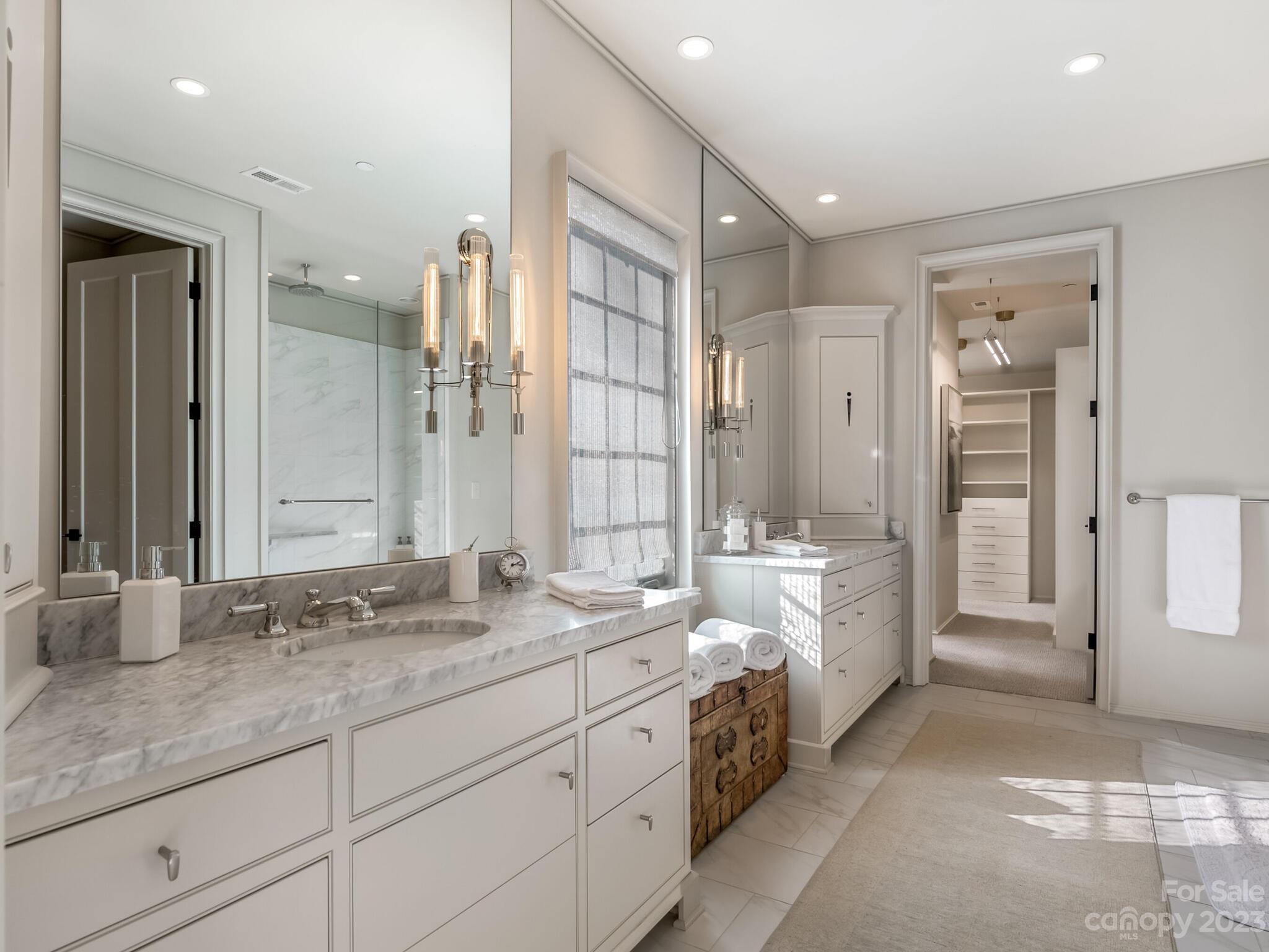 1200 Queens Road Charlotte, NC 28207 - Photo 23 of 42 a spacious bathroom with double sink and a mirror