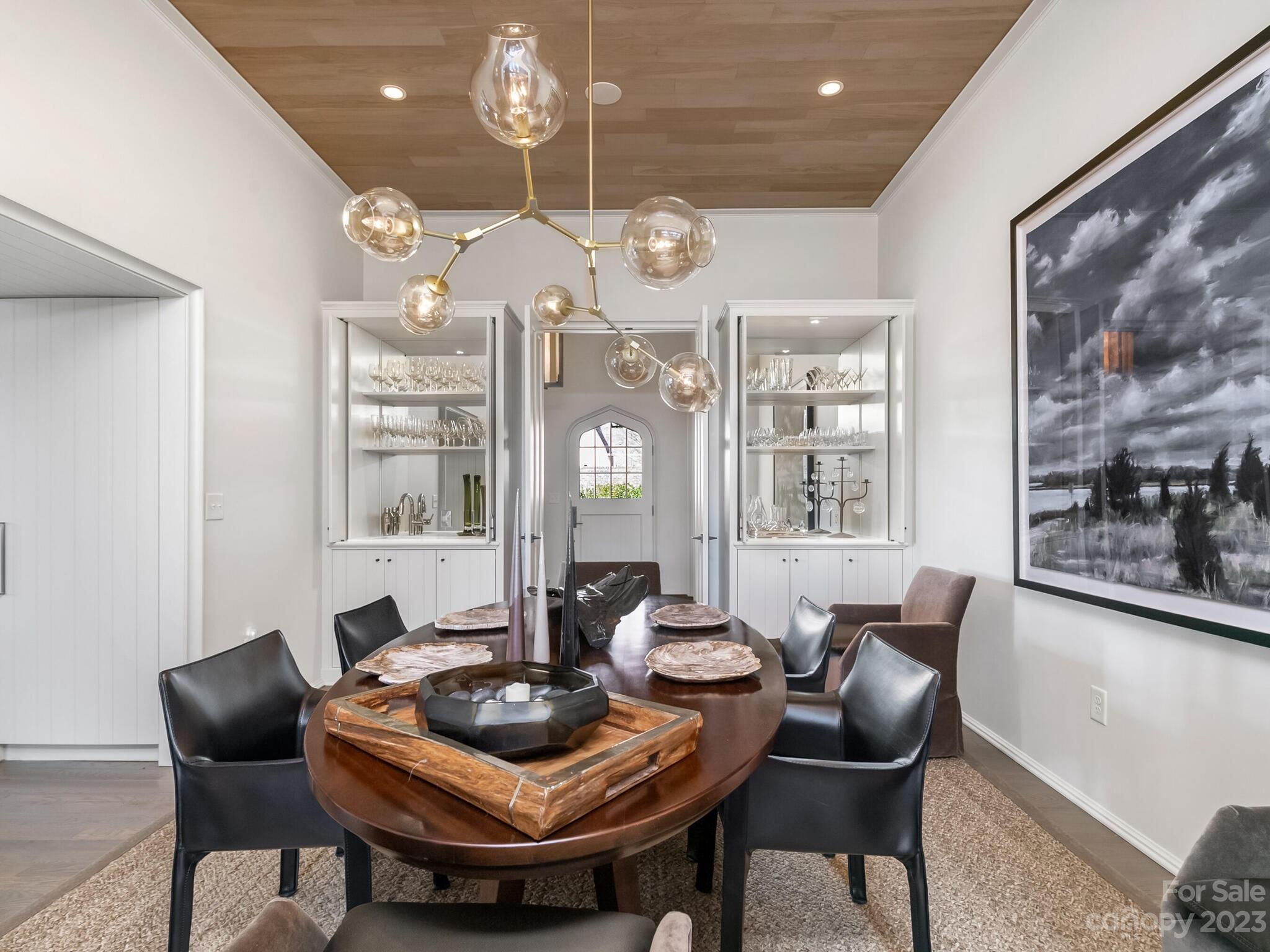 1200 Queens Road Charlotte, NC 28207 - Photo 7 of 42 a view of a dining room with furniture and chandelier