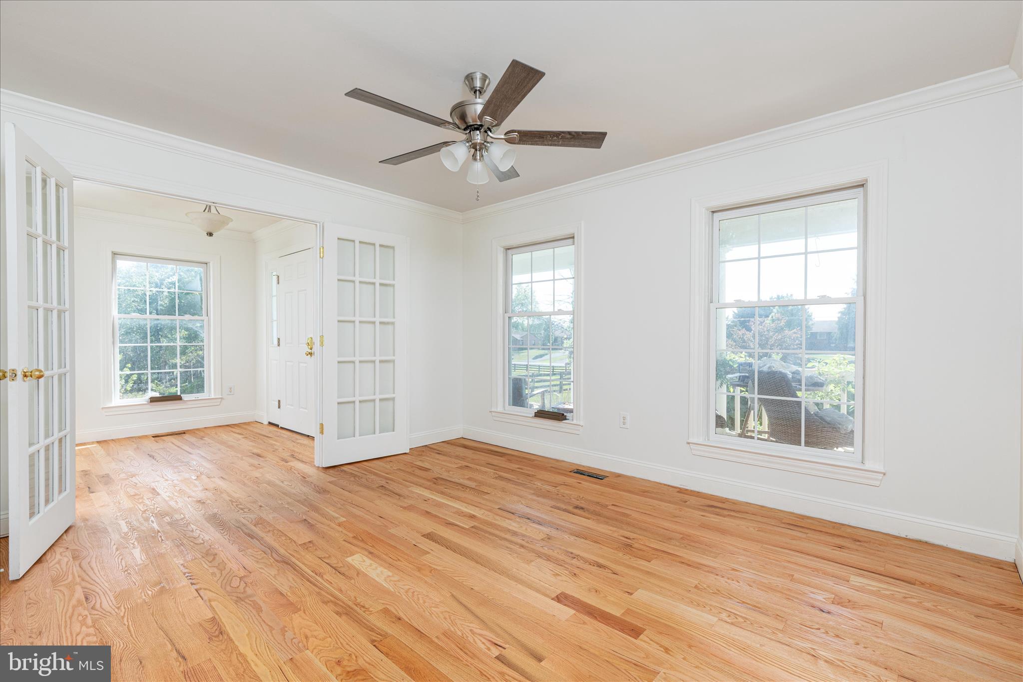 1200 Salem Church Road Stephens City, VA 22655 - Photo 5 of 69 a view of empty room with wooden floor and fan