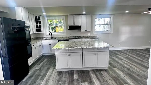 a kitchen with a stove and a sink