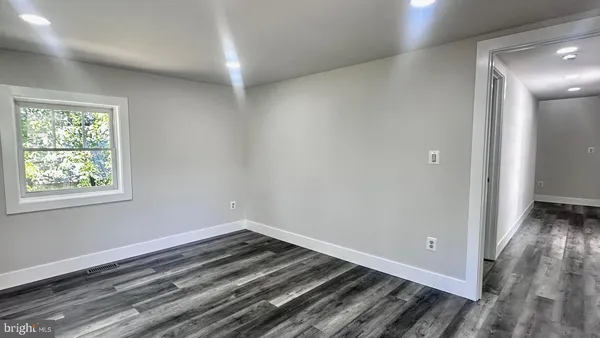 a white toilet sitting next to a bath tub