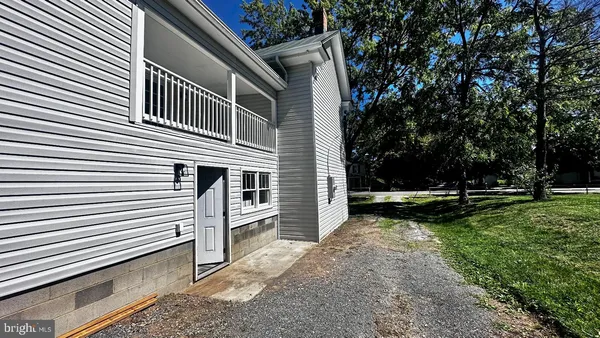a view of a backyard with sitting area