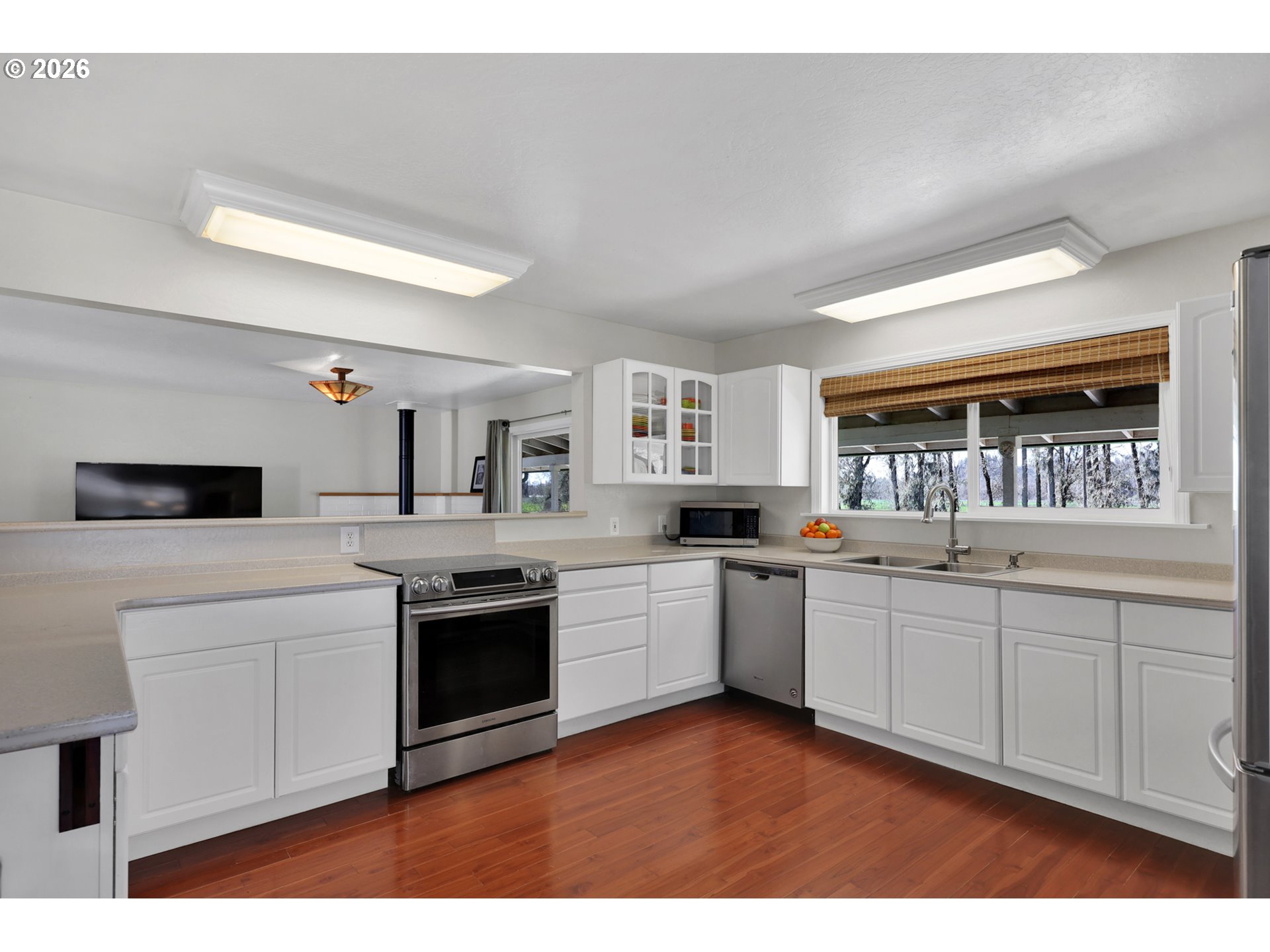 84816 Cloverdale Road Creswell, OR 97426 - Photo 12 of 48 a kitchen with sink and white cabinets