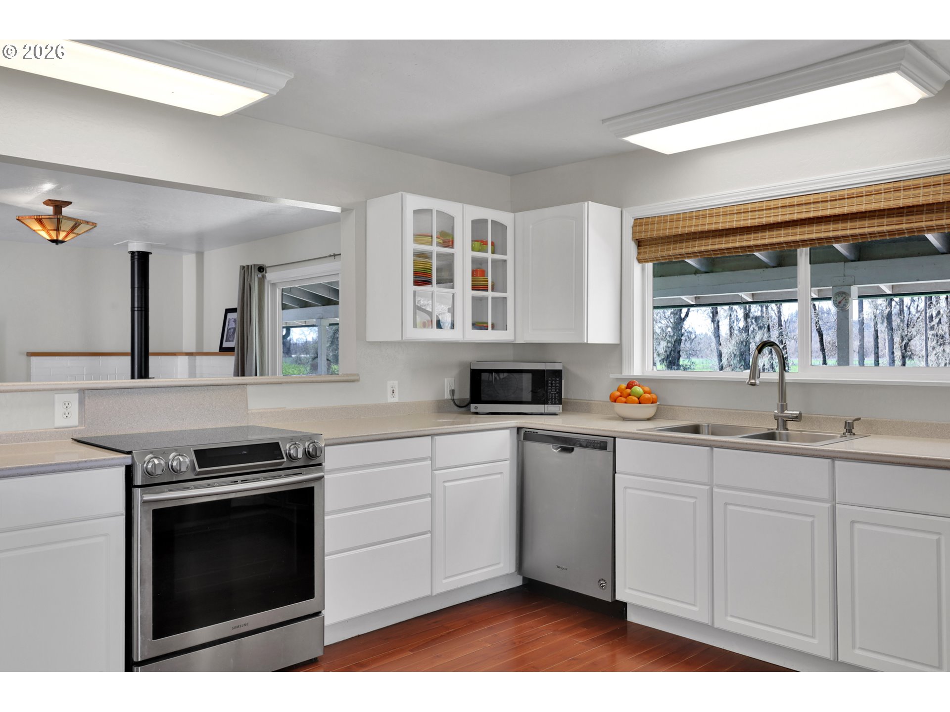 84816 Cloverdale Road Creswell, OR 97426 - Photo 14 of 48 a kitchen with stainless steel appliances granite countertop a stove a sink and a microwave