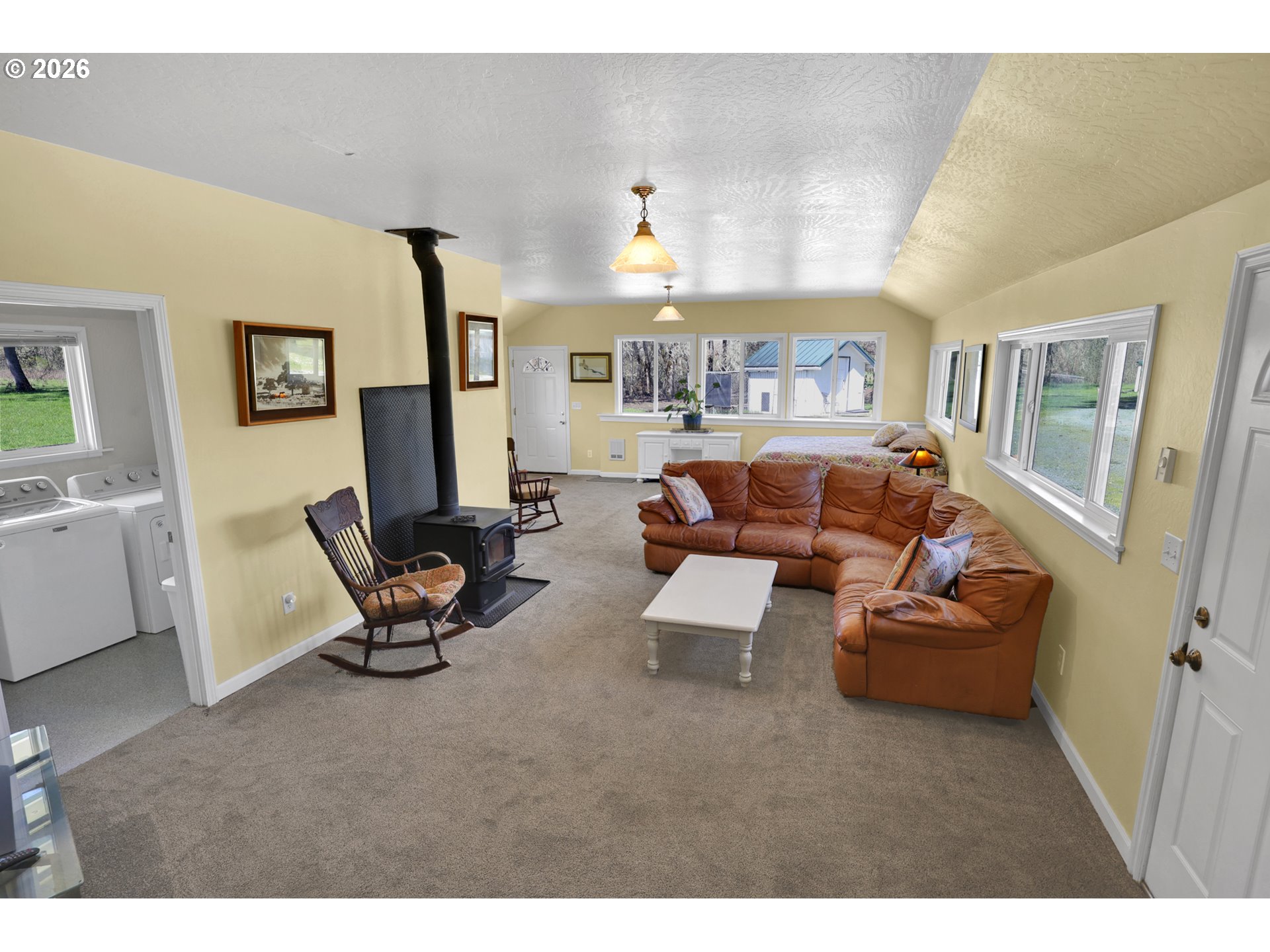 84816 Cloverdale Road Creswell, OR 97426 - Photo 16 of 48 a living room with furniture and a chandelier