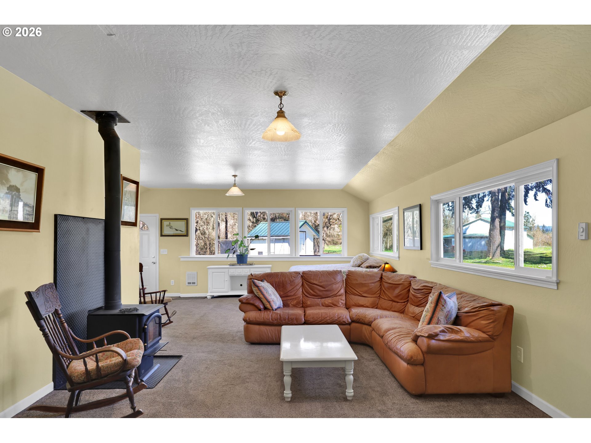 84816 Cloverdale Road Creswell, OR 97426 - Photo 17 of 48 a living room with furniture a wall paintings and a window