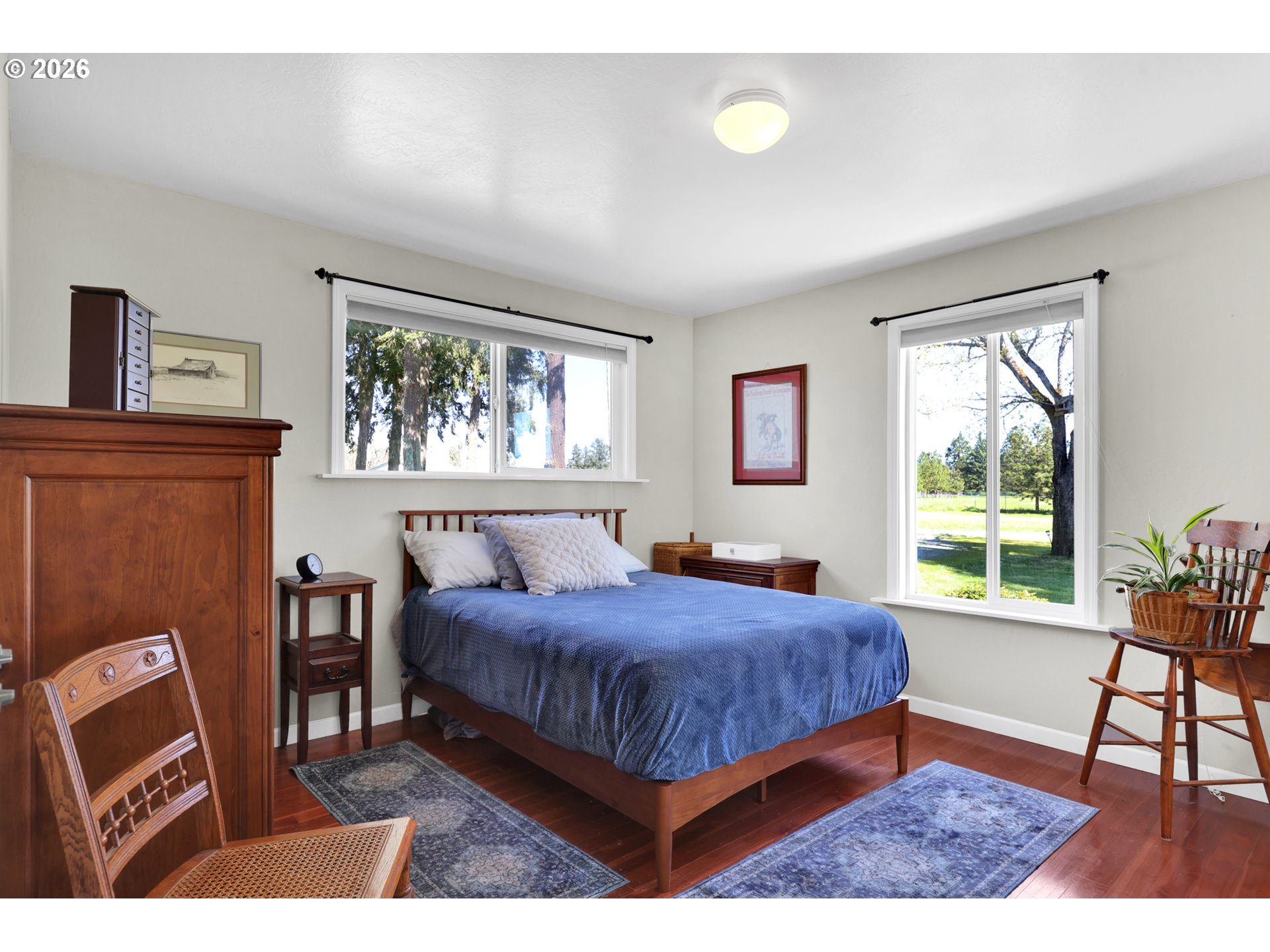 84816 Cloverdale Road Creswell, OR 97426 - Photo 21 of 48 a bedroom with a bed window and a table