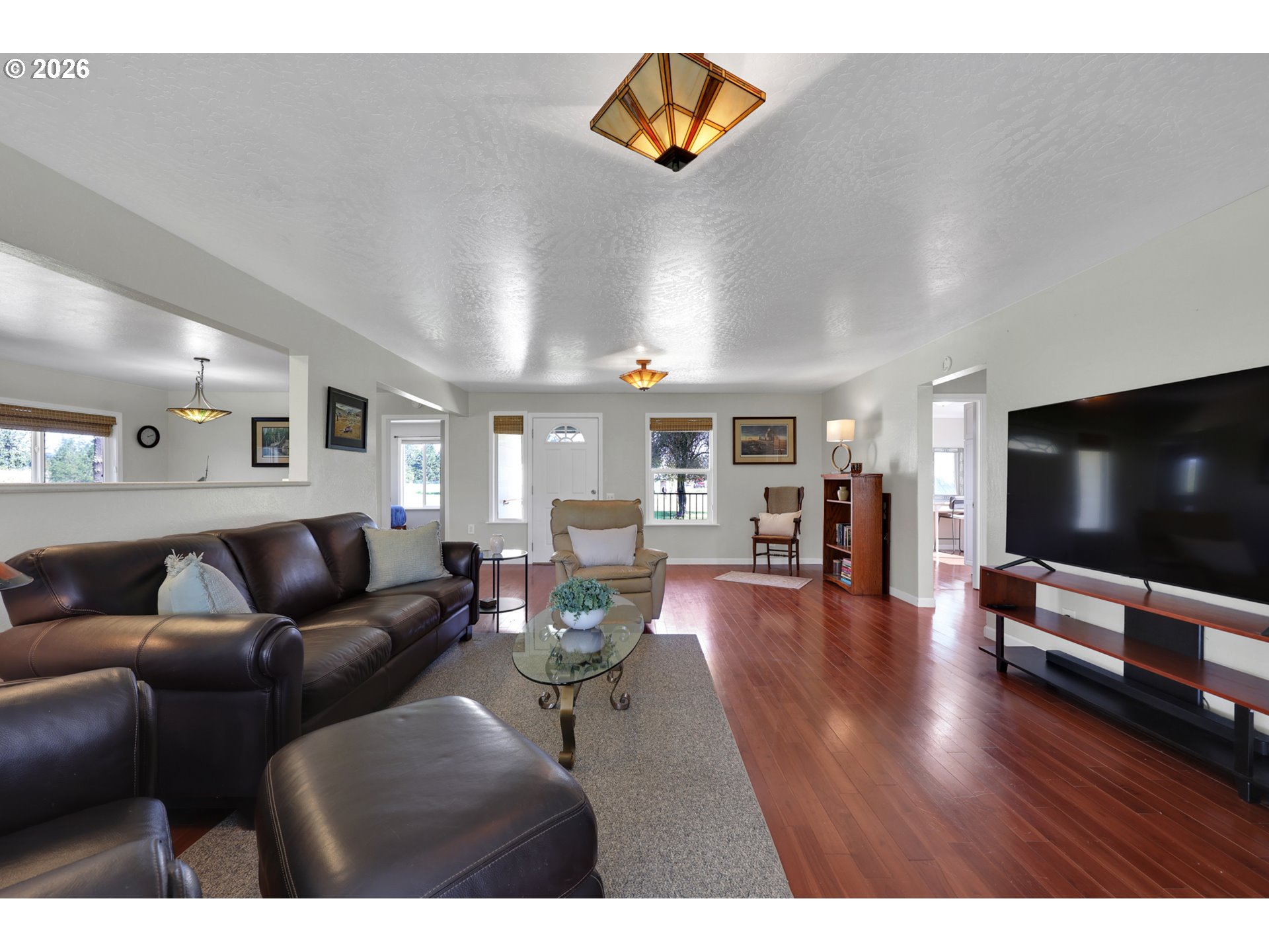 84816 Cloverdale Road Creswell, OR 97426 - Photo 9 of 48 a living room with furniture and a flat screen tv