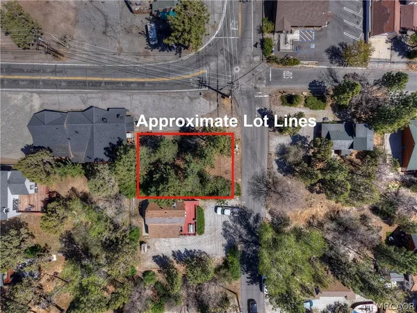 an aerial view of a house outdoor space and street view