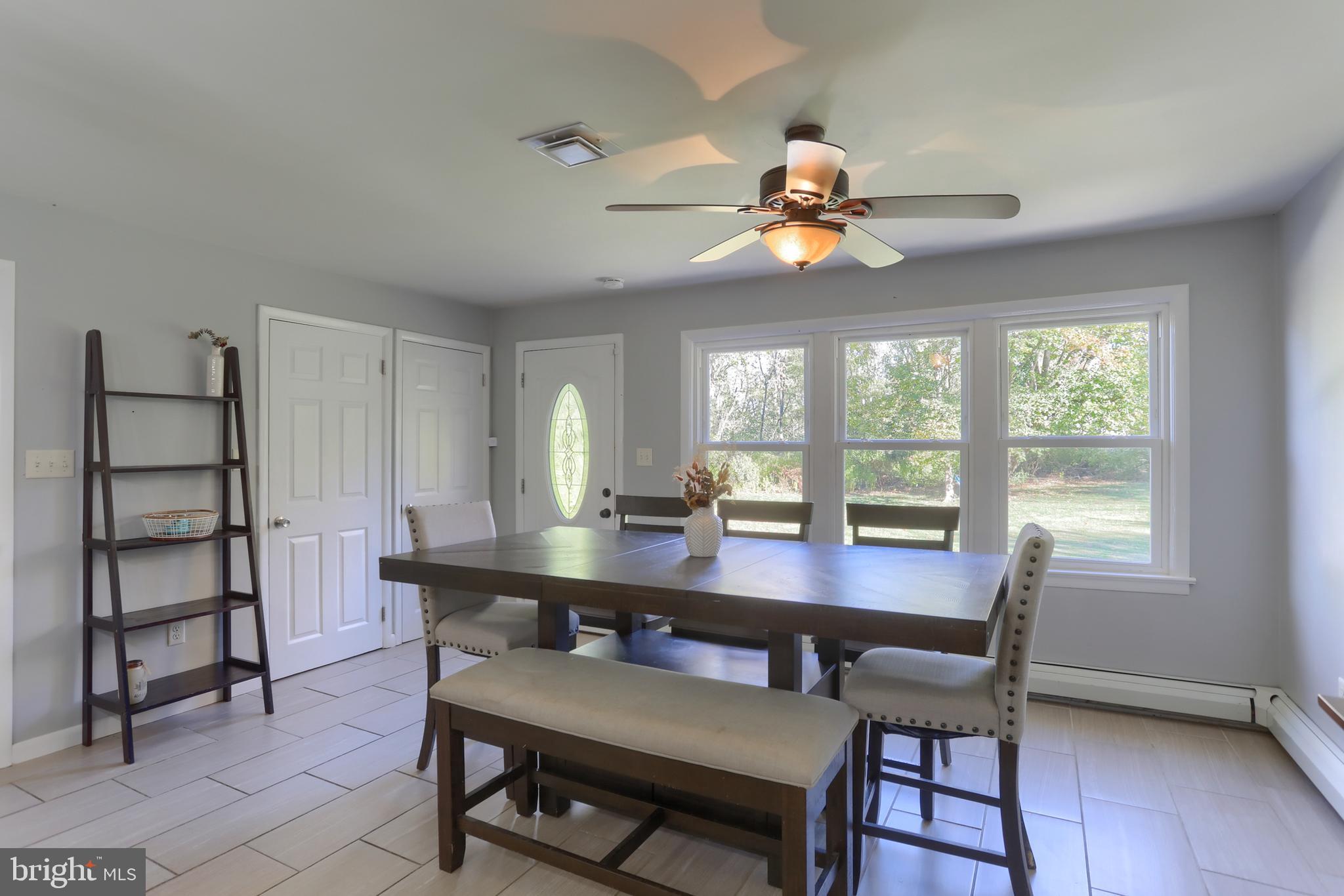 508 Noble Street Lebanon, PA 17042 - Photo 15 of 37 a view of a dining room with furniture window and wooden floor