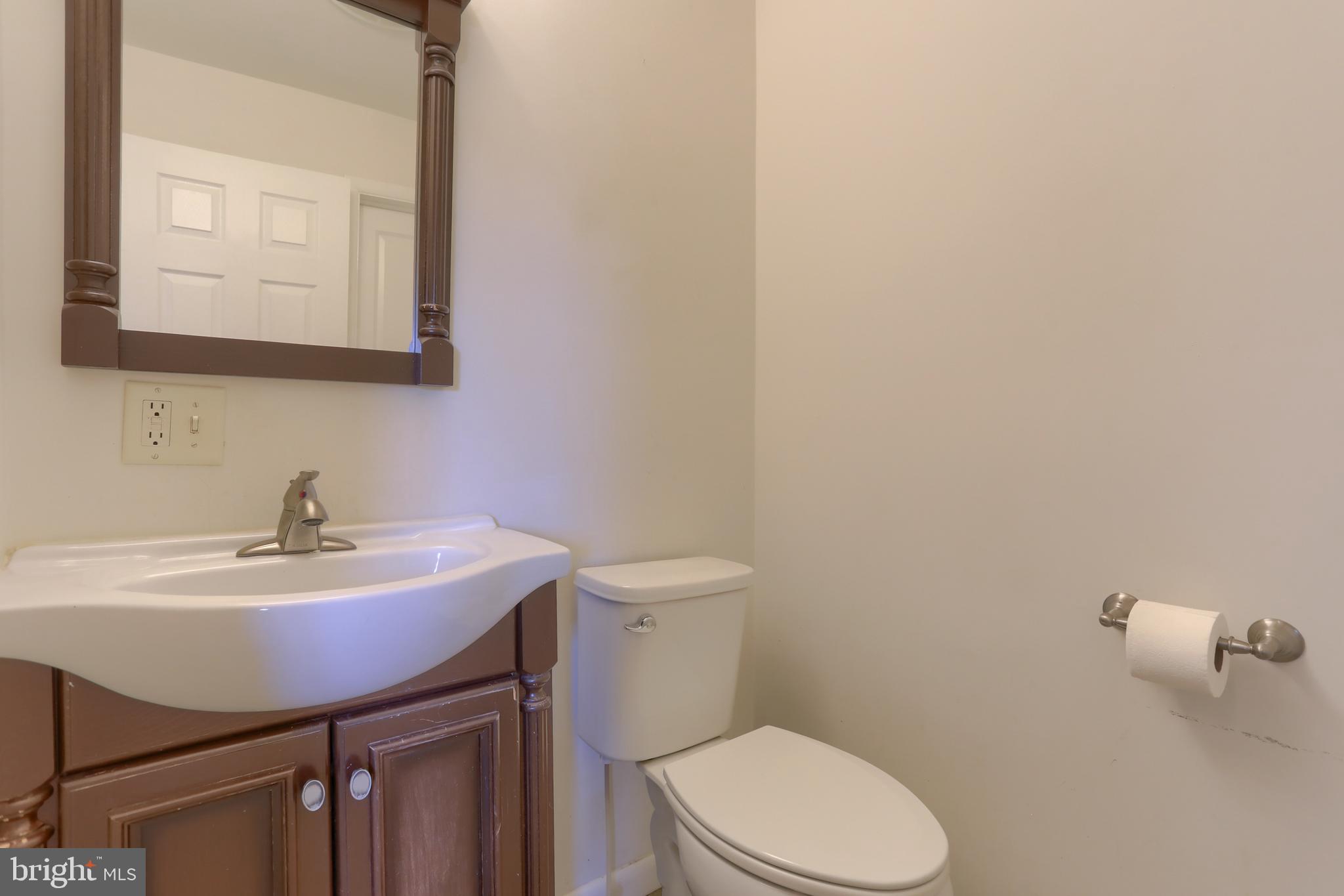 508 Noble Street Lebanon, PA 17042 - Photo 19 of 37 a bathroom with a sink a toilet and mirror