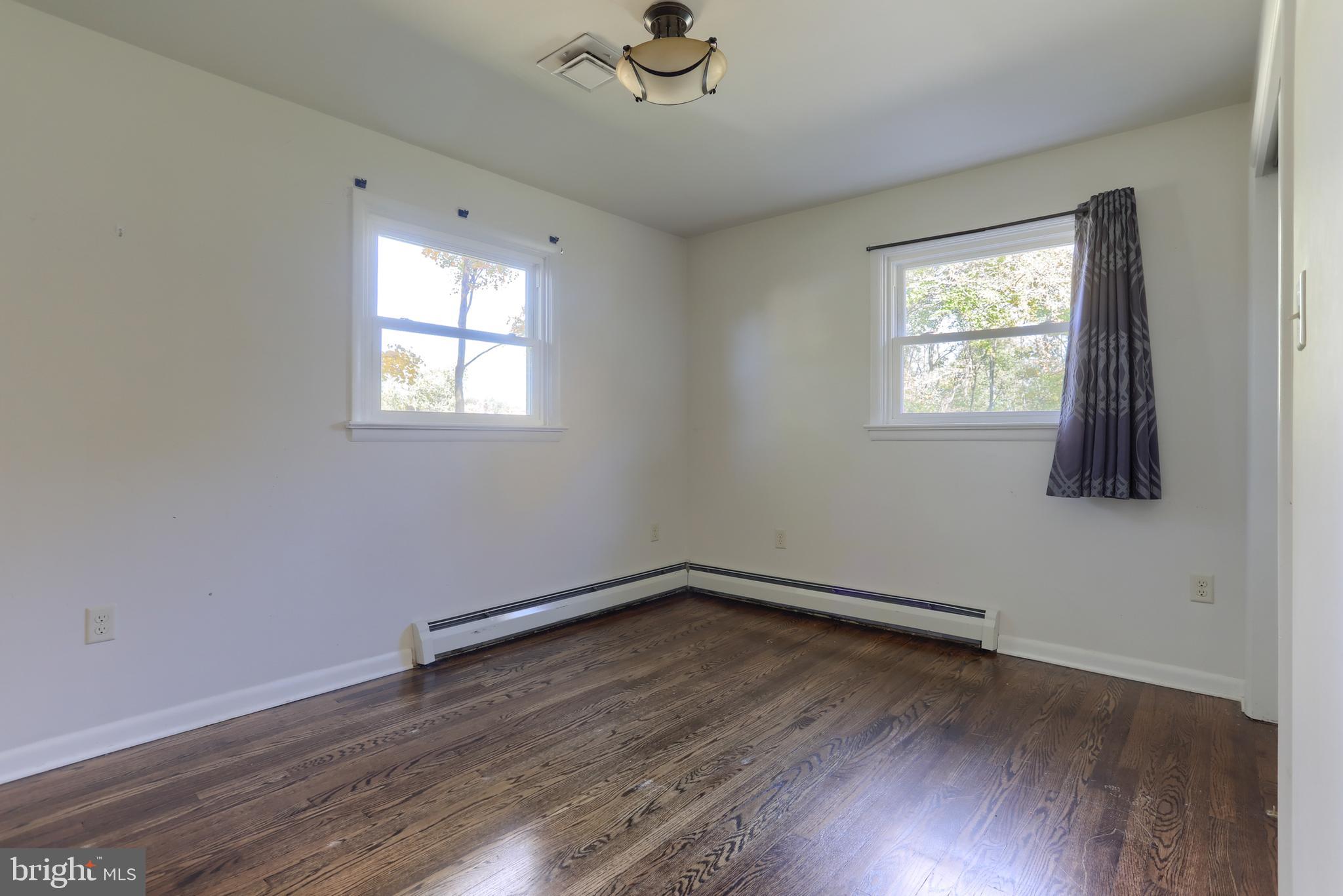 508 Noble Street Lebanon, PA 17042 - Photo 24 of 37 a view of a room with wooden floor and windows