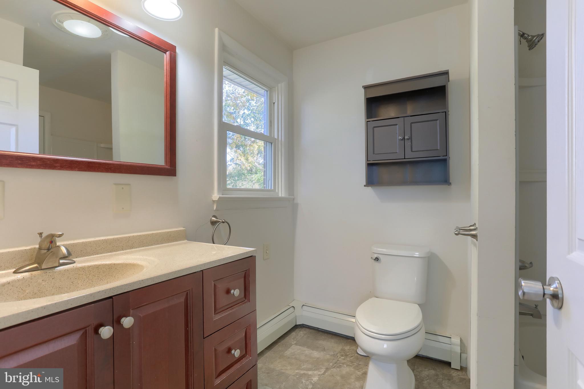508 Noble Street Lebanon, PA 17042 - Photo 25 of 37 a bathroom with a sink toilet and mirror