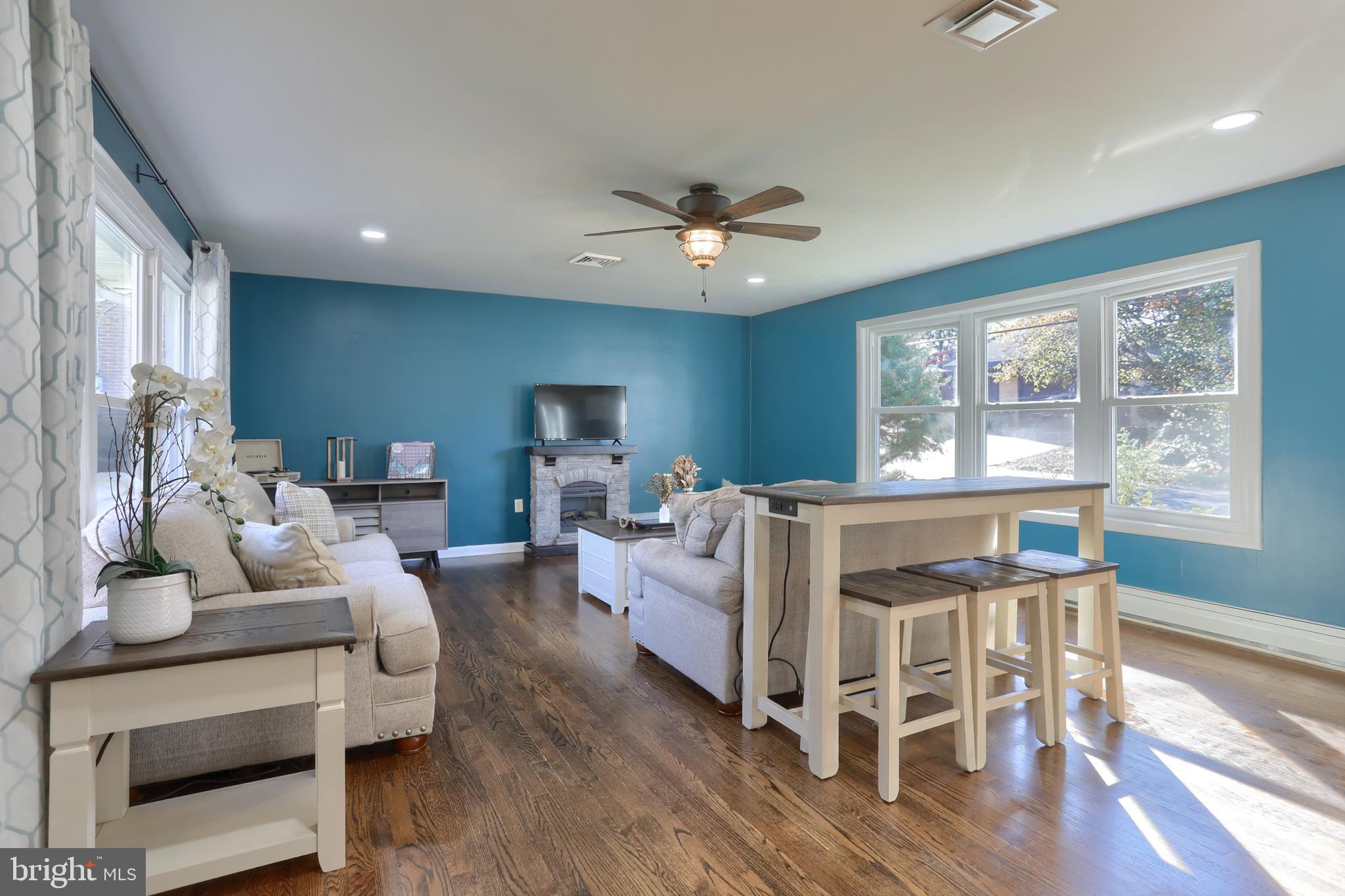 508 Noble Street Lebanon, PA 17042 - Photo 7 of 37 a living room with furniture a large window and wooden floor