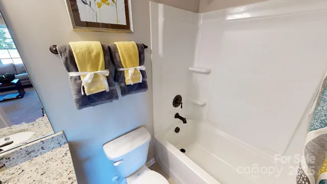 a bathroom with a bathtub and toilet