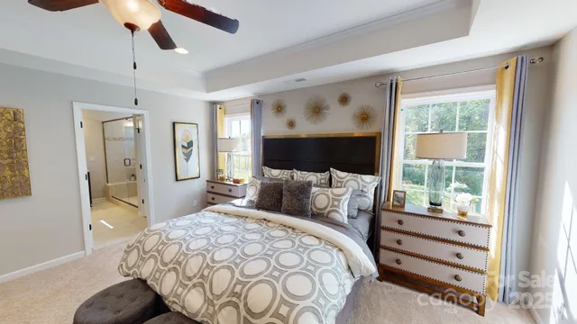 a bedroom with a bed and glass window