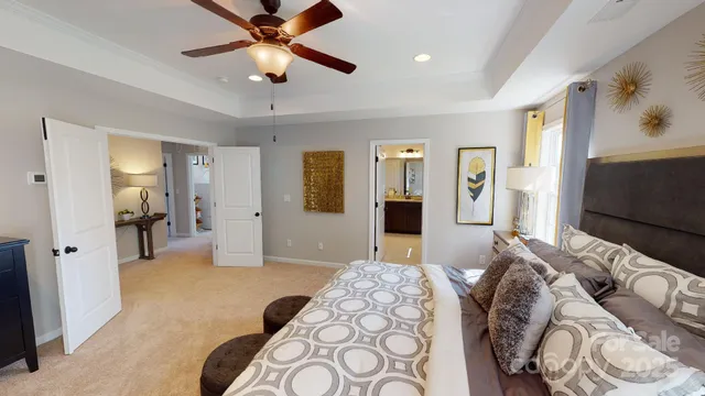 a bedroom with furniture and a chandelier