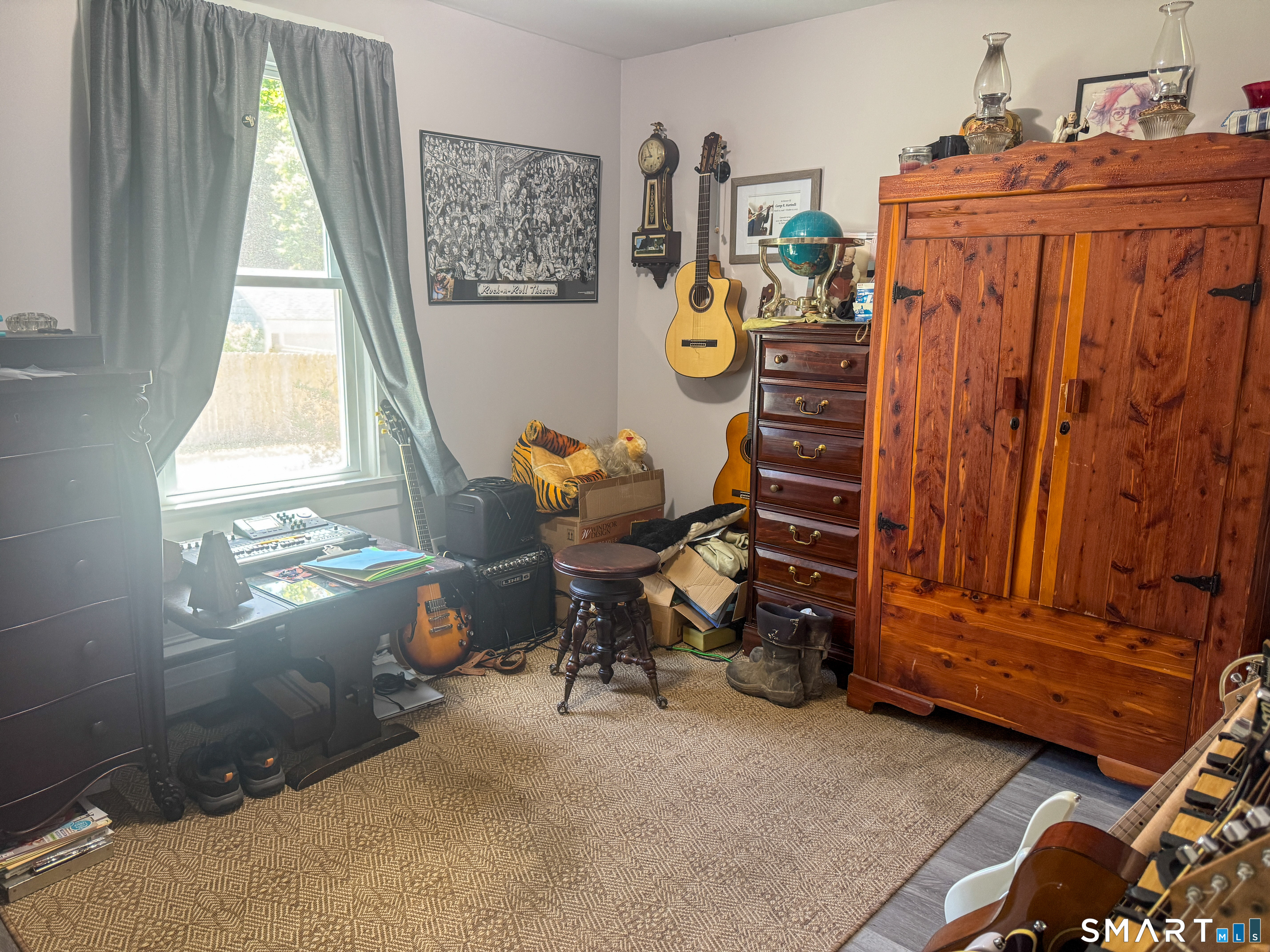 36 Jennings Street Norwich, CT 06360 - Photo 19 of 33 a view of a workspace with furniture and a window