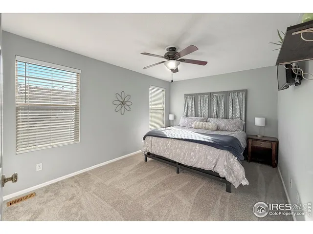 a view of walk in closet with clothes