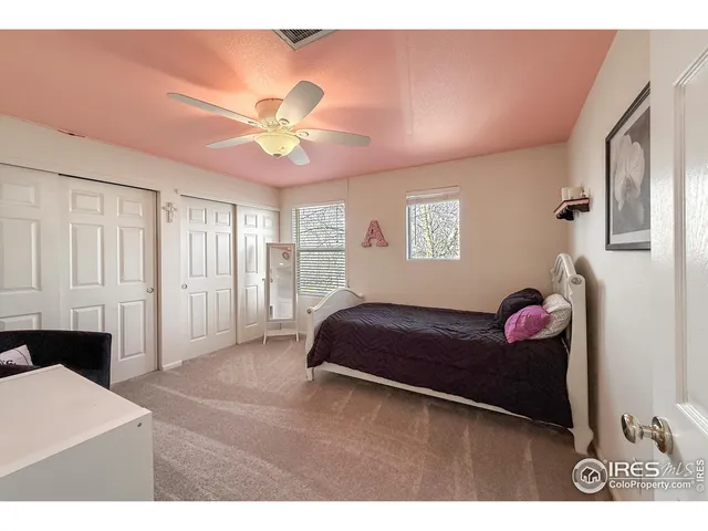 a bedroom with furniture and a chandelier