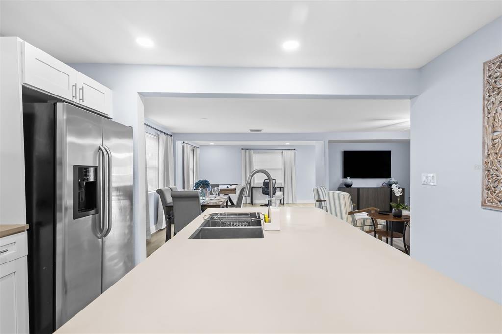 3708 North 56th Street Tampa, FL 33619 - Photo 12 of 22 a large bedroom with a bed and large flat screen tv