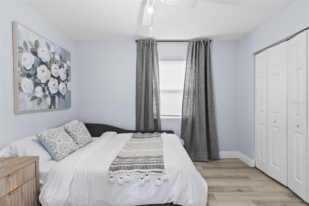 3708 North 56th Street Tampa, FL 33619 - Photo 18 of 22 a bedroom with a large bed and a window