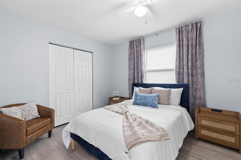 3708 North 56th Street Tampa, FL 33619 - Photo 21 of 22 a bedroom with a bed and a couch