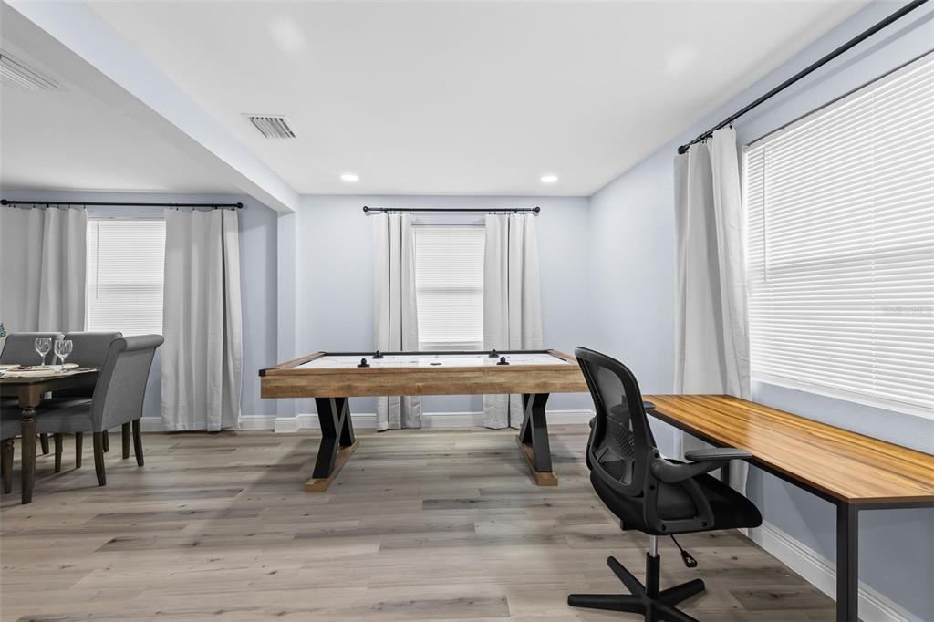 3708 North 56th Street Tampa, FL 33619 - Photo 4 of 22 a room with furniture pool table and windows