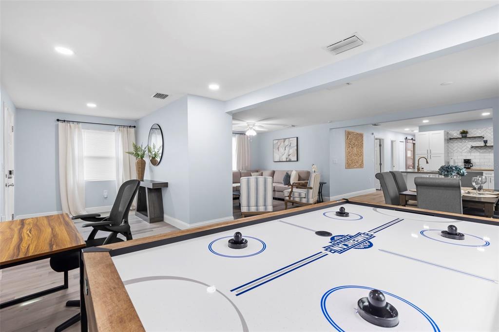 3708 North 56th Street Tampa, FL 33619 - Photo 5 of 22 a room with gym equipment and a table