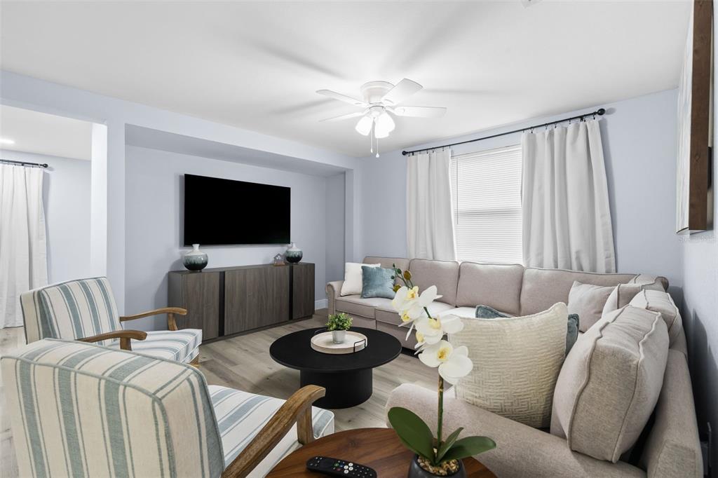 3708 North 56th Street Tampa, FL 33619 - Photo 7 of 22 a living room with furniture and a flat screen tv