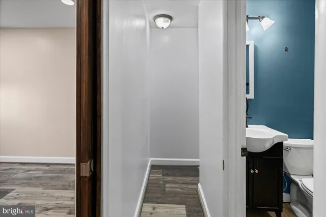a view of a bathroom from a hallway