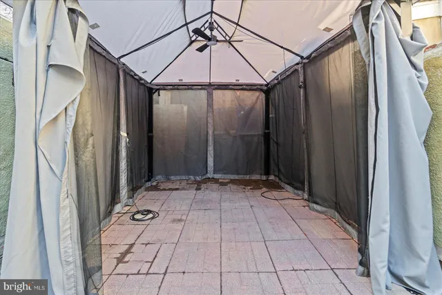 a front view of a house with a empty space and a window