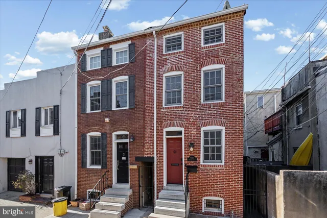 a front view of a building with a street
