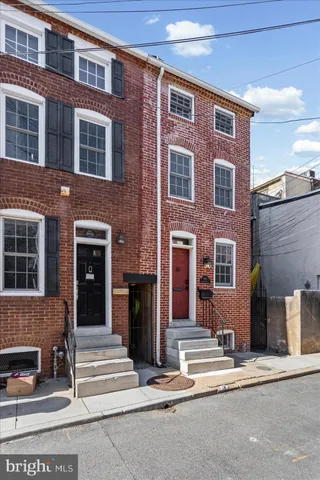 a view of a brick building with a street sign