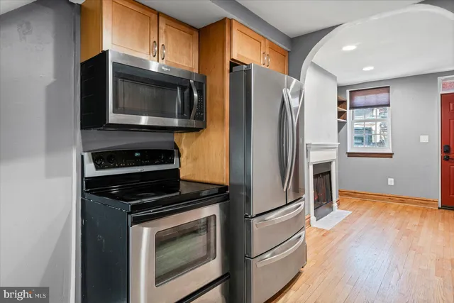 a kitchen with a refrigerator stove and microwave