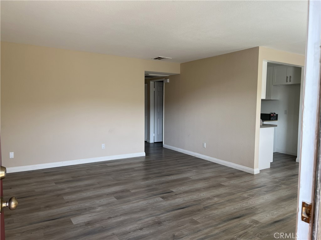 800 Grand Avenue, Unit C4 Diamond Bar, CA 91765 - Photo 7 of 19 a view of an empty room with wooden floor and a window