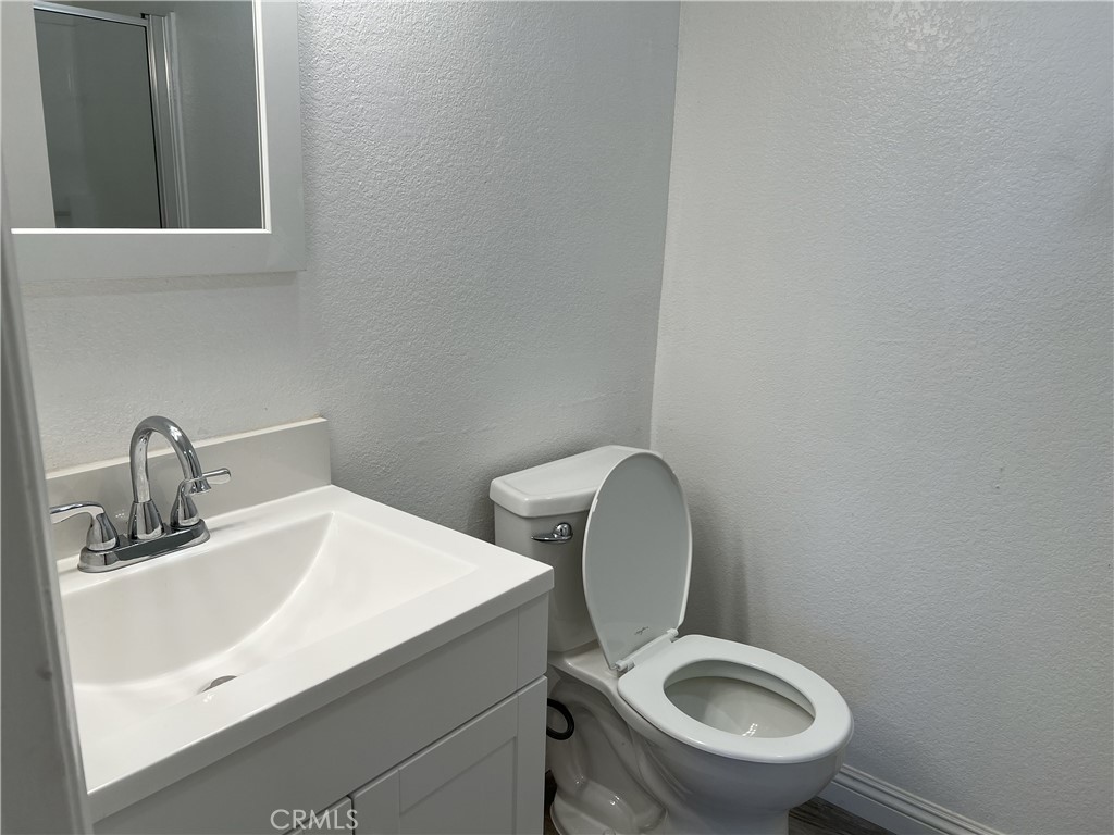 800 Grand Avenue, Unit C4 Diamond Bar, CA 91765 - Photo 9 of 19 a white toilet sitting next to a bathroom sink
