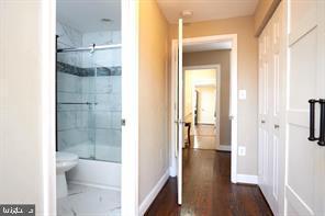 518 South Luzerne Avenue Baltimore, MD 21224 - Photo 15 of 21 Modern hallway with stylish bathroom access.