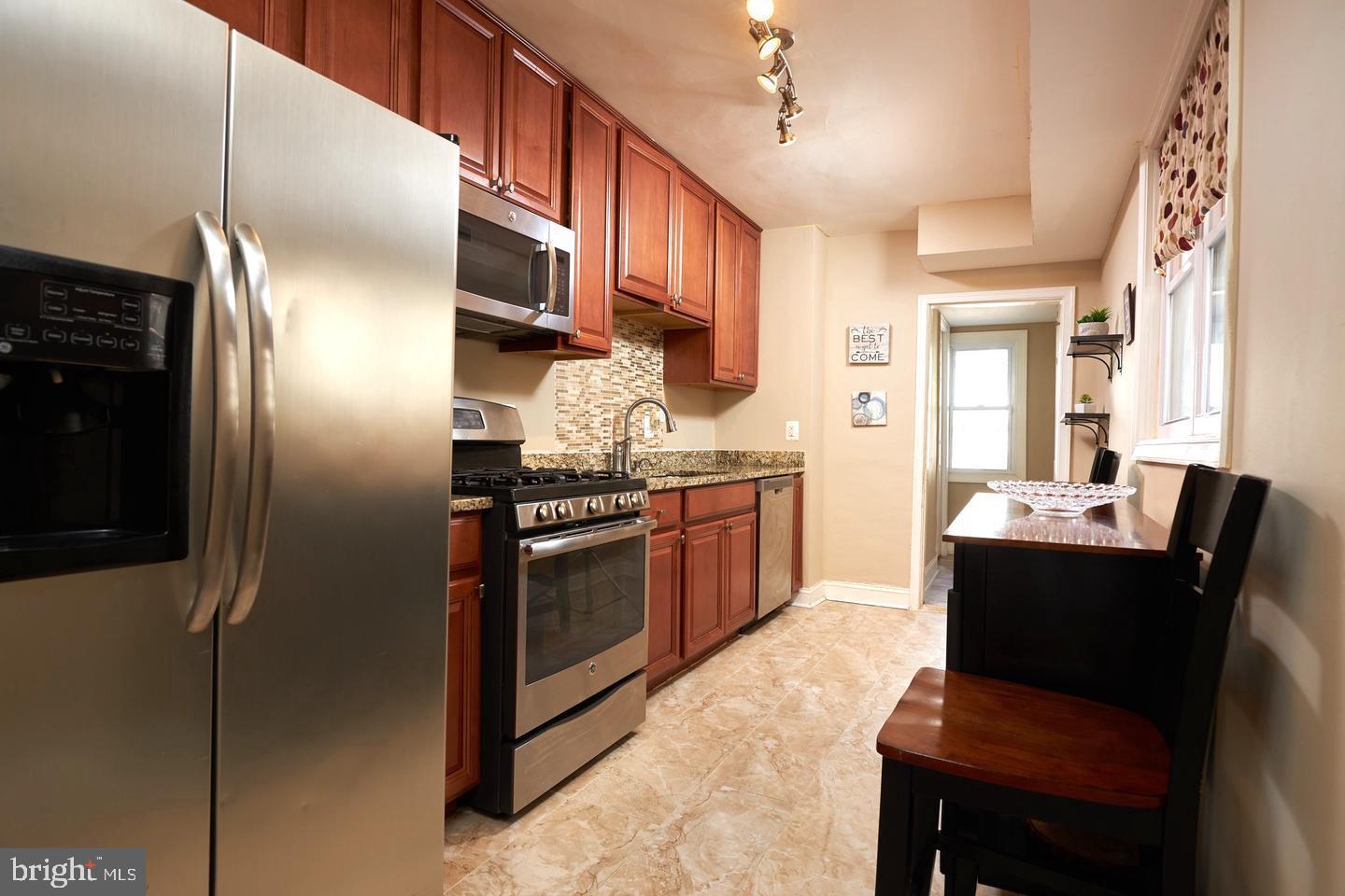 518 South Luzerne Avenue Baltimore, MD 21224 - Photo 6 of 21 Modern kitchen with sleek finishes.