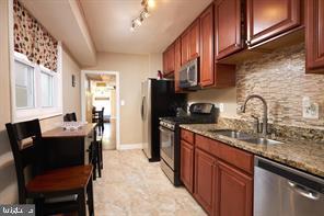518 South Luzerne Avenue Baltimore, MD 21224 - Photo 7 of 21 Modern kitchen with sleek finishes.