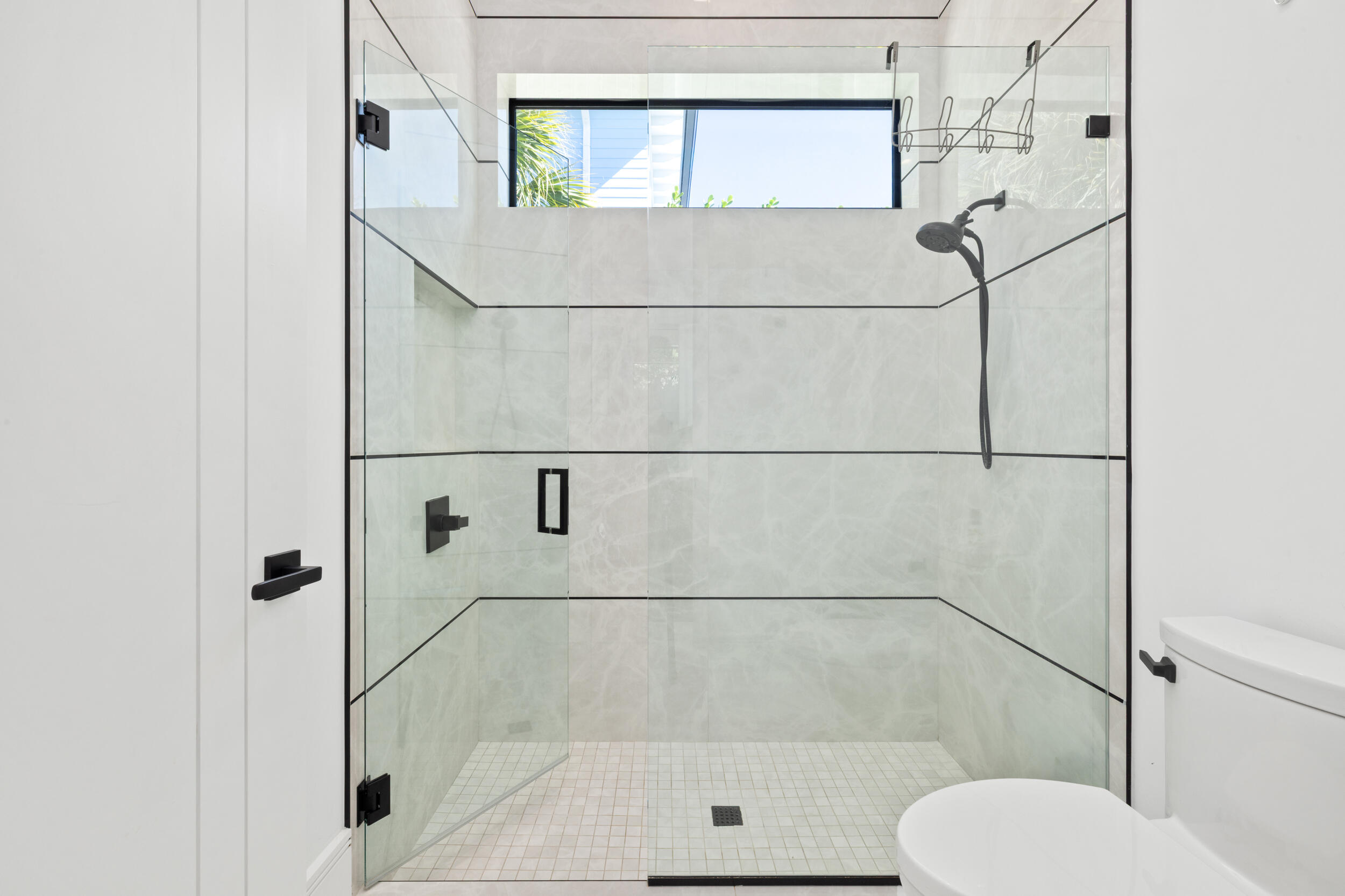 10 Coconut Road Delray Beach, FL 33444 - Photo 23 of 41 a bathroom with a shower and toilet