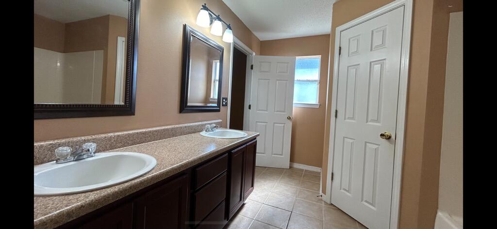 267 Limestone Circle Crestview, FL 32539 - Photo 16 of 21 a bathroom with a sink and a mirror