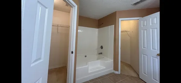 a view of a bathroom from a hallway