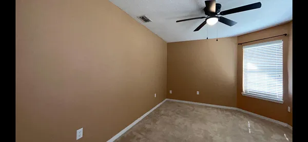 a kitchen with granite countertop a refrigerator a sink and dishwasher
