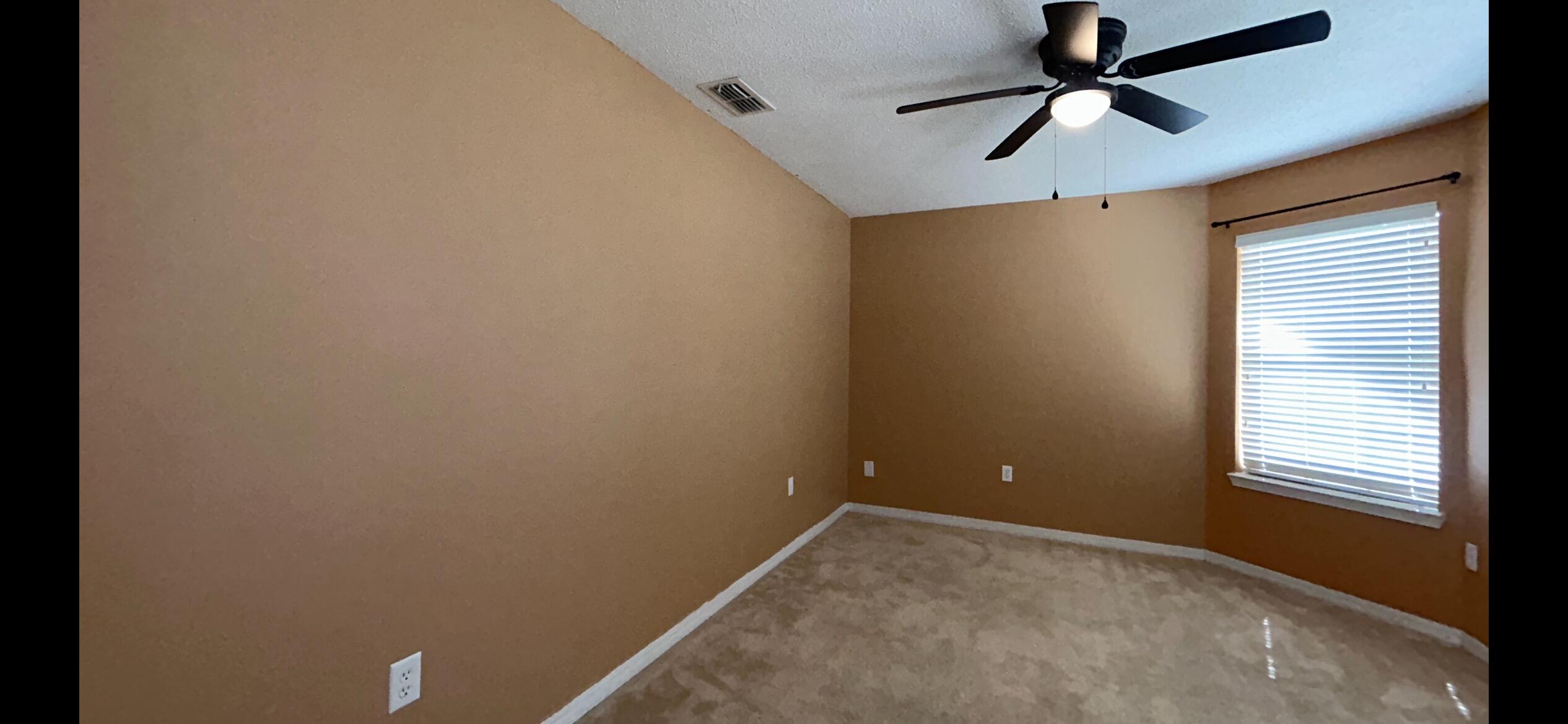 267 Limestone Circle Crestview, FL 32539 - Photo 8 of 21 a view of a room with a ceiling fan and a window