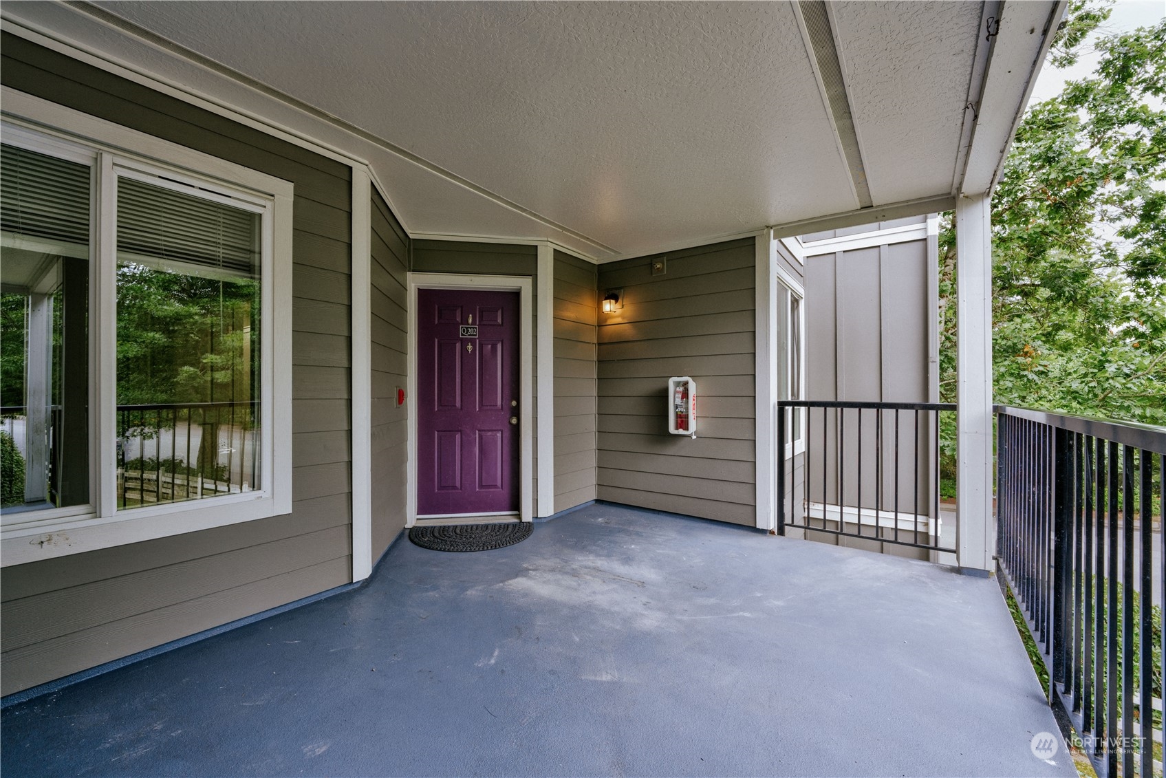 3908 243rd Place Southeast, Unit Q202 Bothell, WA 98021 - Photo 1 of 40 a view of empty room with floor to ceiling window and an outdoor view