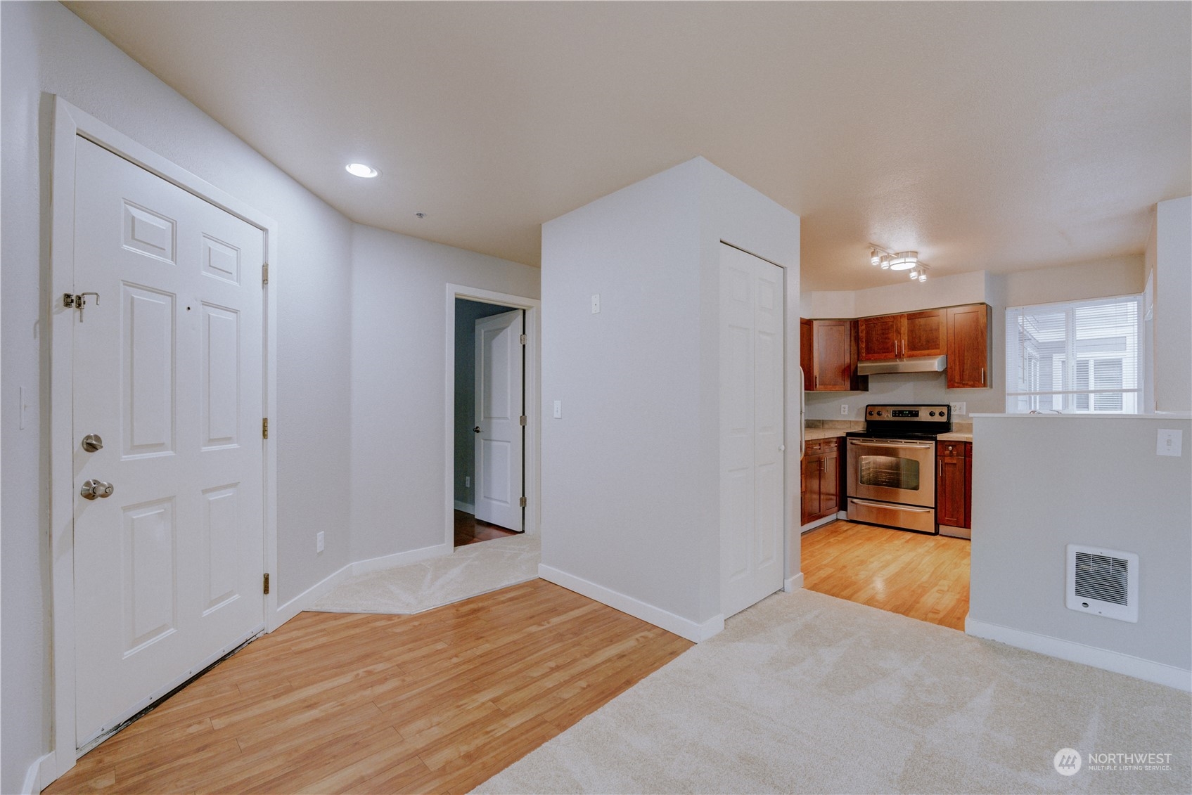 3908 243rd Place Southeast, Unit Q202 Bothell, WA 98021 - Photo 16 of 40 a view of a kitchen with microwave and refrigerator
