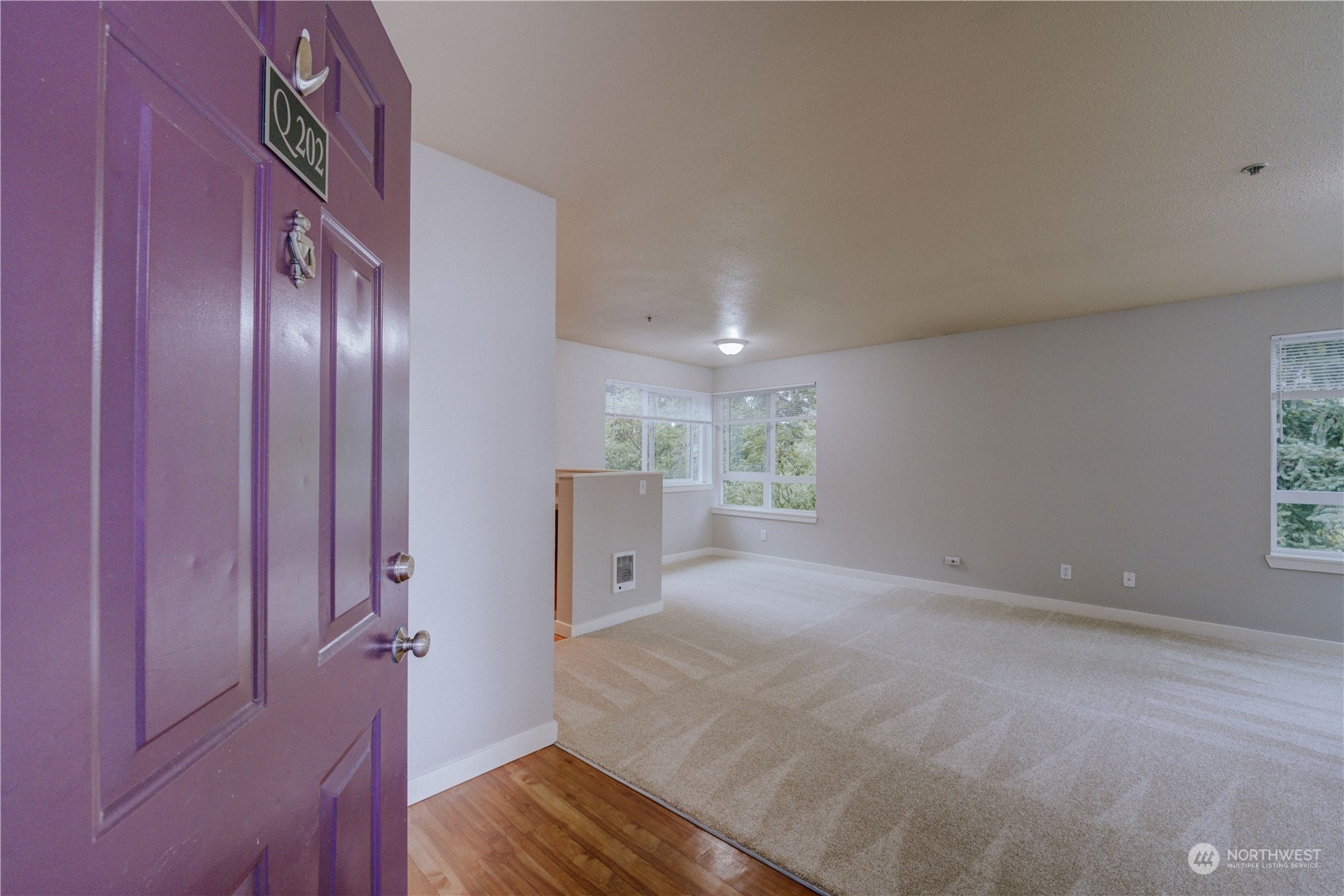 3908 243rd Place Southeast, Unit Q202 Bothell, WA 98021 - Photo 2 of 40 a view of an empty room with a fireplace