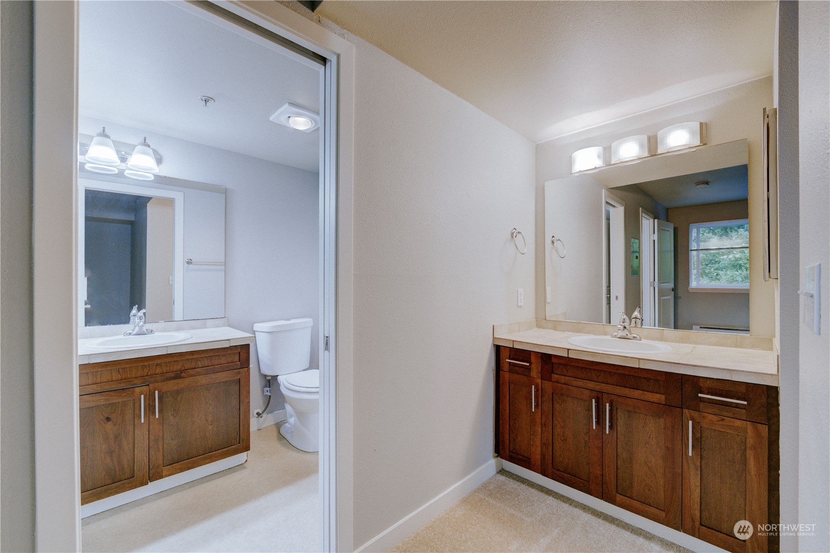 3908 243rd Place Southeast, Unit Q202 Bothell, WA 98021 - Photo 25 of 40 a bathroom with a sink and a mirror