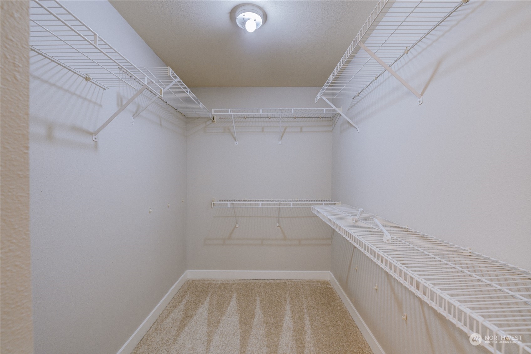 3908 243rd Place Southeast, Unit Q202 Bothell, WA 98021 - Photo 27 of 40 a view of storage and utility room with empty racks